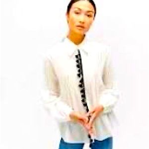 7 For All Mankind Pintuck Tassel Blouse 
30% Silk, 70% Cotton;